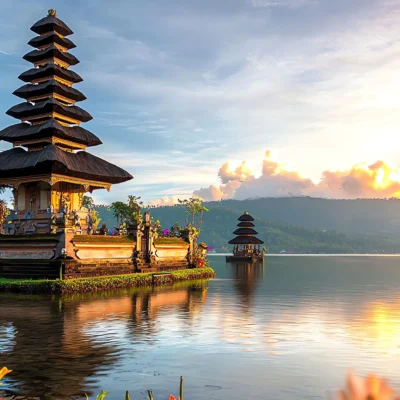 Serene sunrise view of Ulun Danu Beratan Temple, Bali, reflecting on Lake Beratan's tranquil waters.